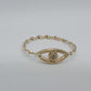 14k twist style yellow band ring with a lucky eye design, 1 Diamond 1.5mm